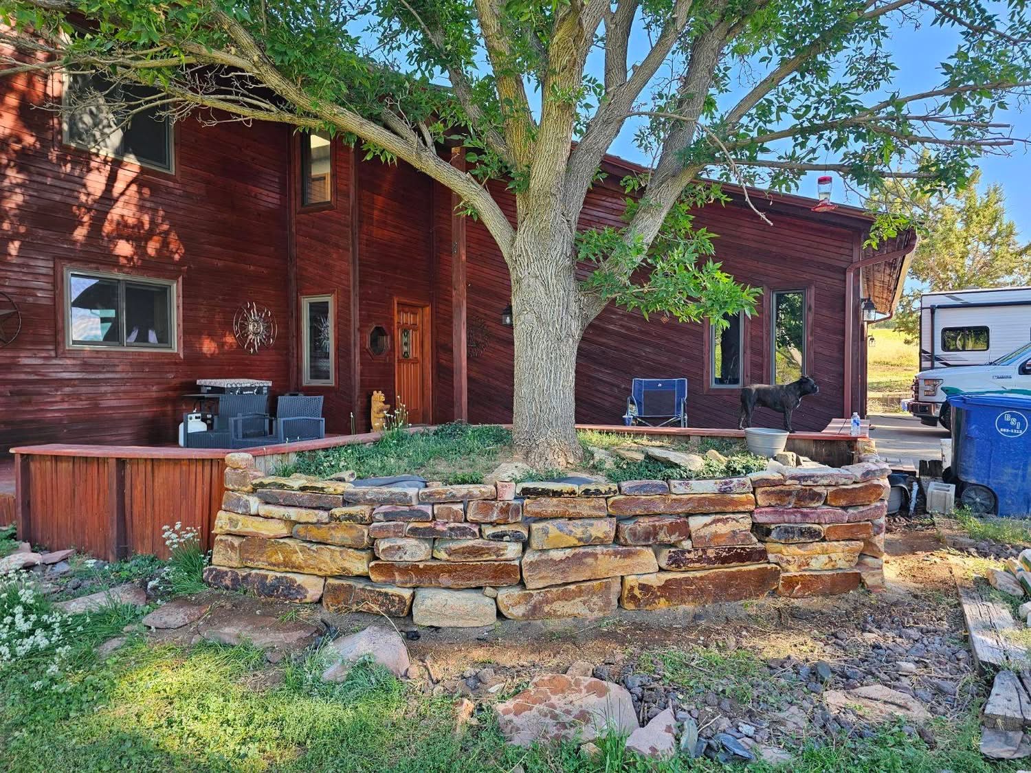 Custom stone planter built around tree